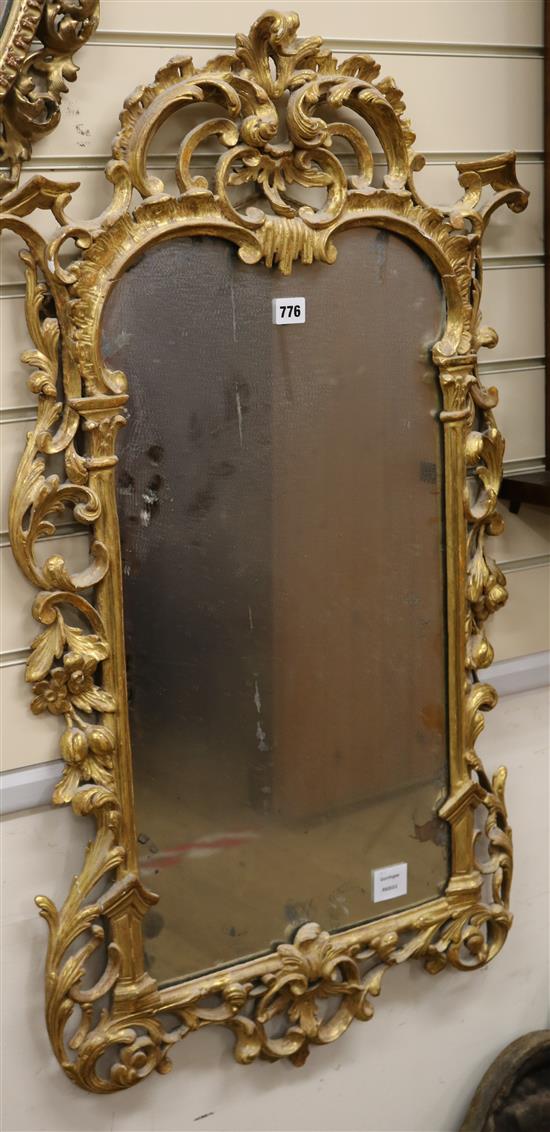 A Chippendale carved gilt wall mirror, the border finely pierced with scrolling acanthus leaves and foliage W.58cm